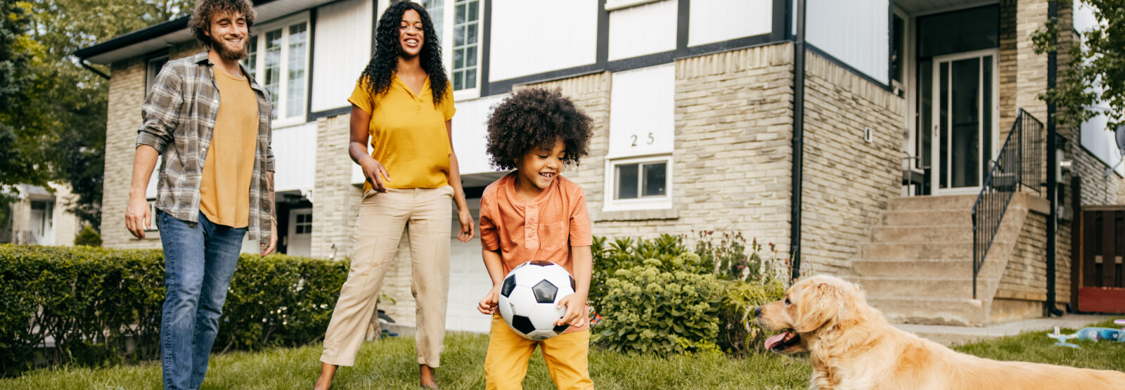 Young family and dog outside
