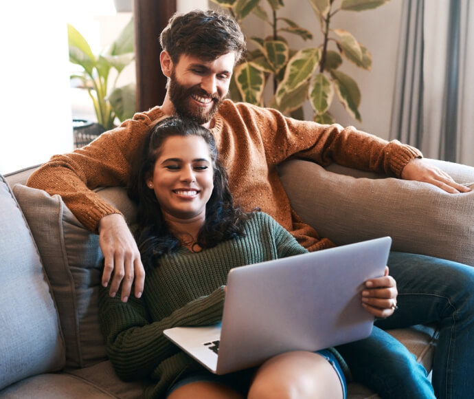 Young couple looking at a laptop
